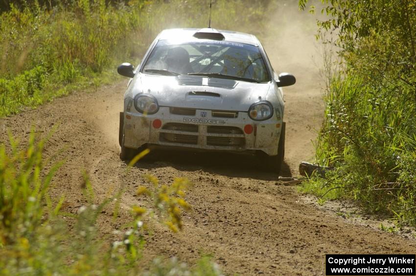 Bruce Davis / Jimmy Brandt Dodge SRT-4 drift through a fast left-hand sweeper on SS10, Chad's Yump.