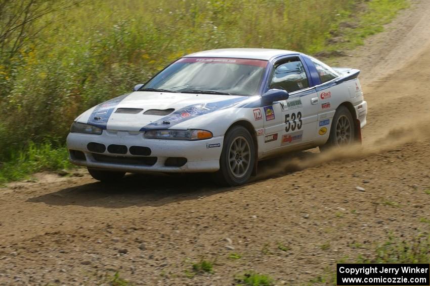 Paul Ritchie / Drew Ritchie Mitsubishi Eclipse GSX at speed through a fast uphill sweeper on SS10, Chad's Yump.