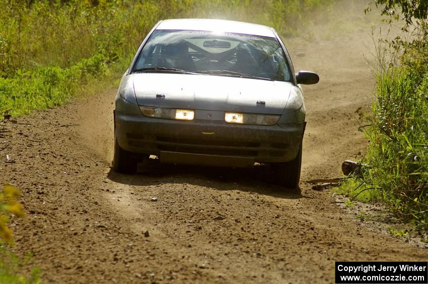 Dan Adamson / Jeremiah Schubitzke Saturn SL2 goes through a left sweeper on SS10, Chad's Yump.