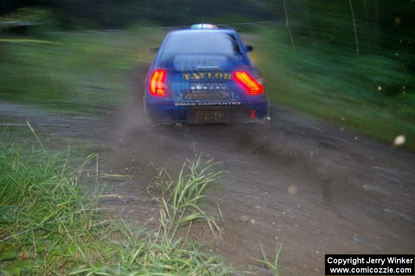 Mark McElduff / Damien Irwin Subaru WRX STi at speed through the spectator point on SS13, Sockeye Lake.