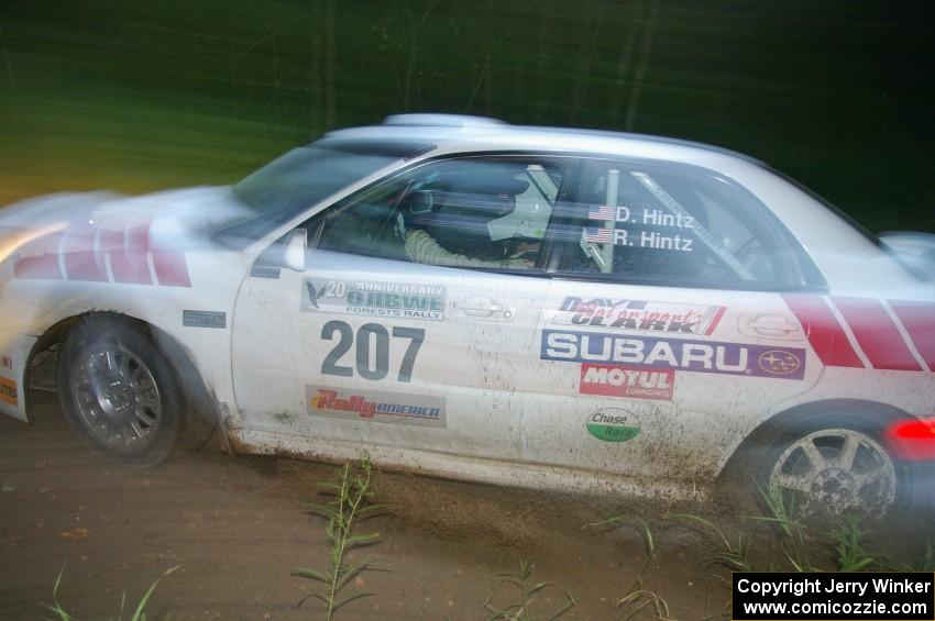 Dave Hintz / Rick Hintz Subaru WRX at speed through the spectator point on SS13, Sockeye Lake.