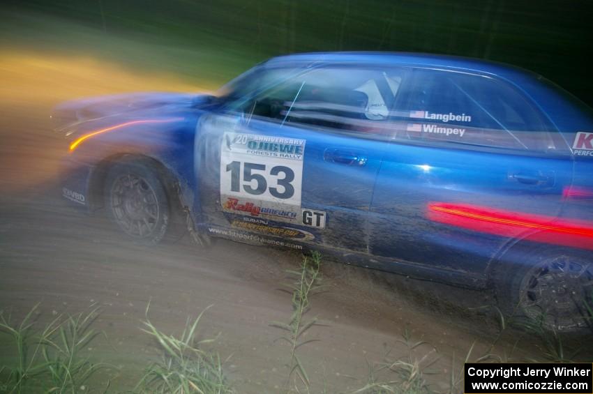 Eric Langbein / Jeremy Wimpey Subaru WRX at dusk through the spectator point on SS13, Sockeye Lake.