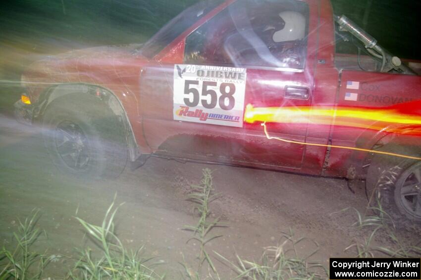 Jim Cox / Richard Donovan Chevy S-10 at speed through the spectator point on SS13, Sockeye Lake.