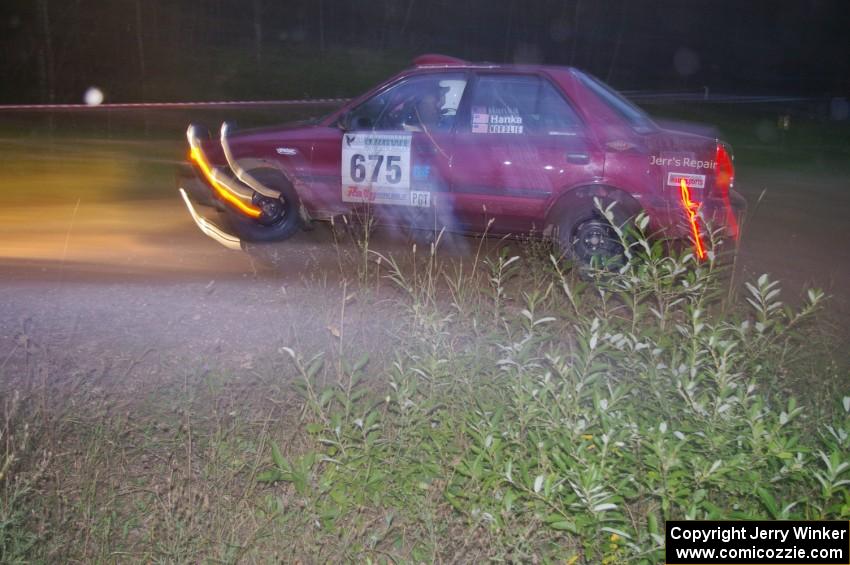 Ben Hanka / John Nordlie Mazda Protege goes through the spectator point on SS13, Sockeye Lake.