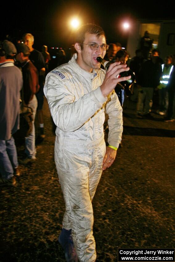 Matt Iorio sips champagne after taking second overall and winning open class in his Subaru Impreza. Ole Holter was his navigator