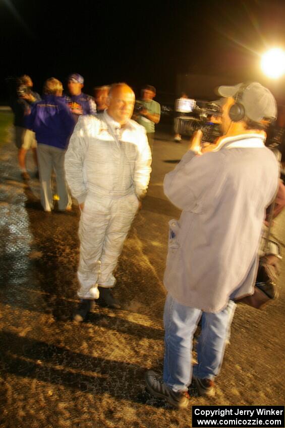 Stig Blomqvist is interviewed after taking his Subaru WRX STi to the win at Ojibwe. Ana Goni was his navigator for the weekend.