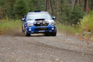 Travis Pastrana / Christian Edstrom Subaru WRX STi heads uphill near the start of SS1, Herman.