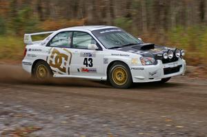 Ken Block / Alex Gelsomino Subaru WRX STi heads uphill near the start of SS1, Herman.