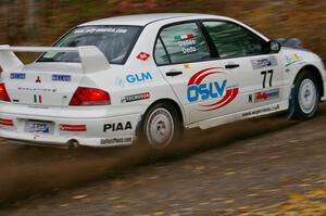 Alfredo De Dominicis / Massimo Daddoveri Mitsubishi Lancer Evo 7 heads uphill near the start of SS1, Herman.