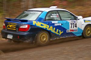 Otis Dimiters / Peter Monin Subaru WRX STi heads uphill near the start of SS1, Herman.