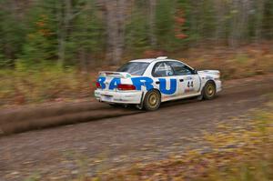 Henry Krolikowski / Cindy Krolikowski Subaru WRX heads uphill near the start of SS1, Herman.