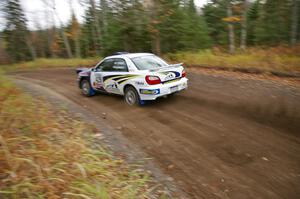 Tanner Foust / Scott Crouch Subaru WRX heads uphill near the start of SS1, Herman.