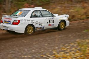 Fintan McCarthy / Noel Gallagher Subaru WRX STi heads uphill near the start of SS1, Herman.