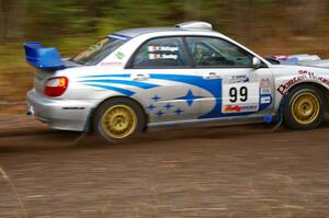 Fintan Seeley / Paddy McCague Subaru WRX STi heads uphill near the start of SS1, Herman.