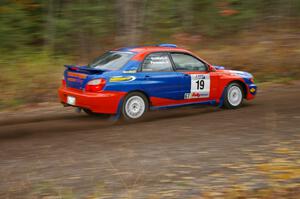 Tim Penasack / Marc Goldfarb Subaru WRX heads uphill near the start of SS1, Herman.