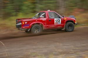 Jim Cox / Ryan LaMothe Chevy S-10 heads uphill near the start of SS1, Herman.