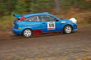 Adam Boullion / Phil Boullion Ford Focus heads uphill near the start of SS1, Herman.