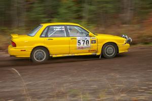 Erik Payeur / Micah Payeur Mitsubishi Galant VR-4 heads uphill near the start of SS1, Herman.