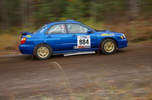 Tim Stevens / Jeff Hagan Subaru WRX heads uphill near the start of SS1, Herman.