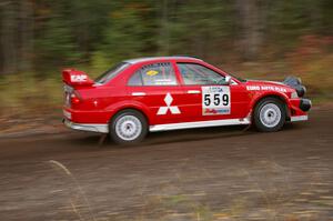 John Rek / Rob Dupree Mitsubishi Lancer Evo 6.5 heads uphill near the start of SS1, Herman.