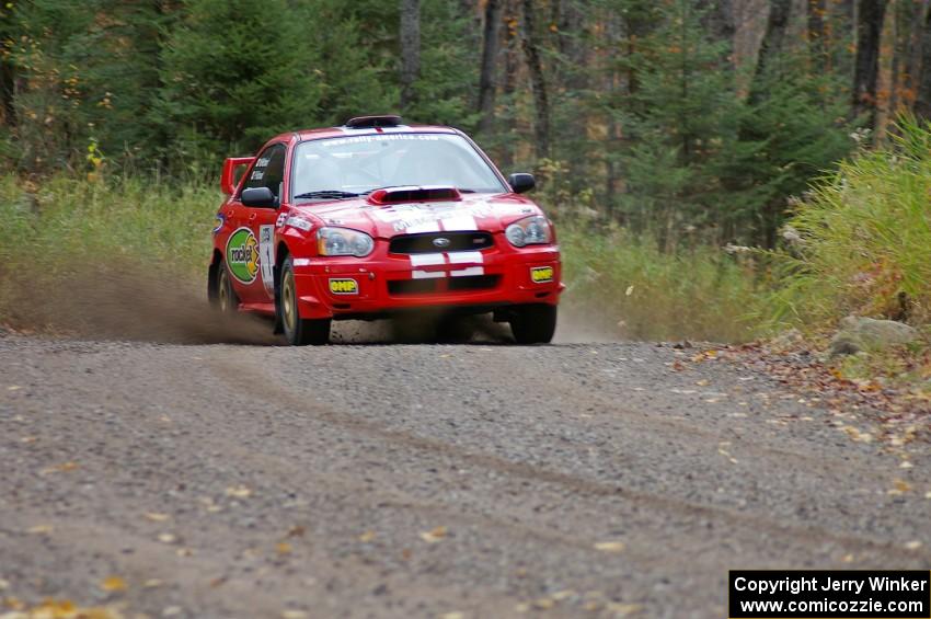 Pat Richard / Nathalie Richard Subaru WRX STi heads uphill near the start of SS1, Herman.