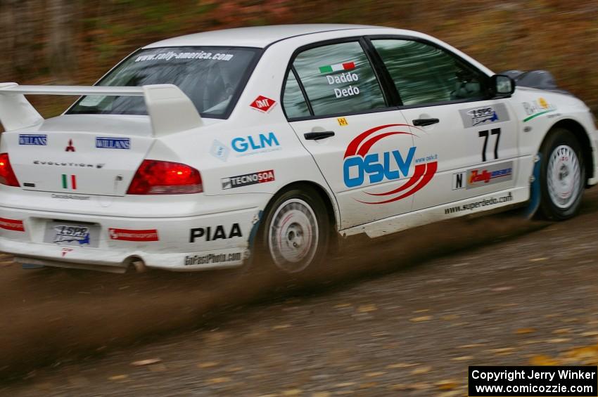 Alfredo De Dominicis / Massimo Daddoveri Mitsubishi Lancer Evo 7 heads uphill near the start of SS1, Herman.