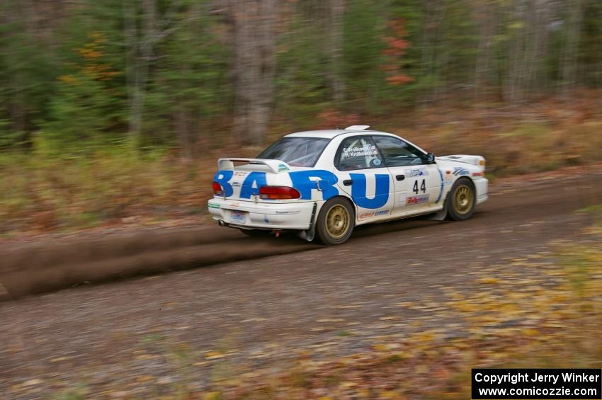 Henry Krolikowski / Cindy Krolikowski Subaru WRX heads uphill near the start of SS1, Herman.