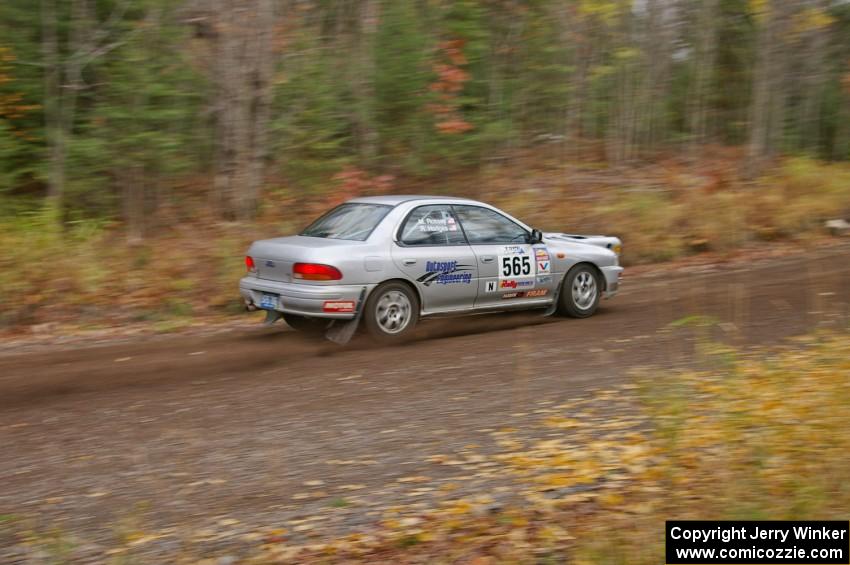 Russ Hodges / Mike Rossey Subaru Impreza heads uphill near the start of SS1, Herman.