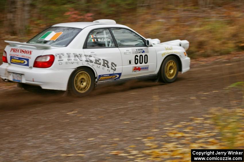 Fintan McCarthy / Noel Gallagher Subaru WRX STi heads uphill near the start of SS1, Herman.