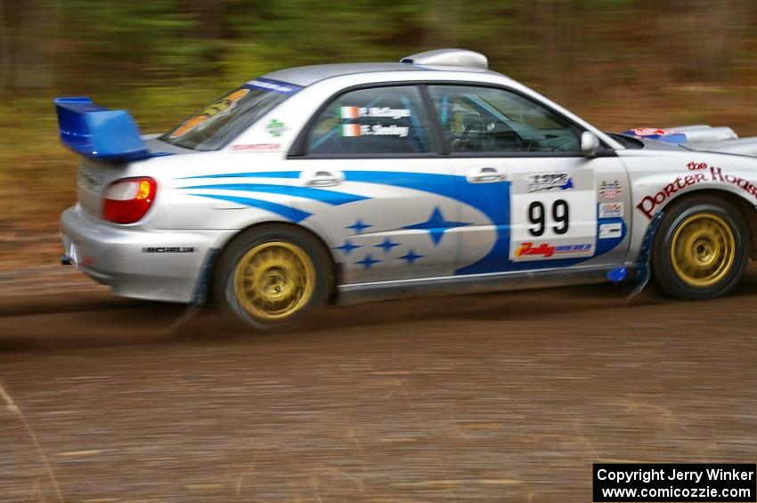 Fintan Seeley / Paddy McCague Subaru WRX STi heads uphill near the start of SS1, Herman.