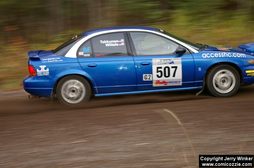 Micah Wiitala / Jason Takkunen Saturn SL2 heads uphill near the start of SS1, Herman.