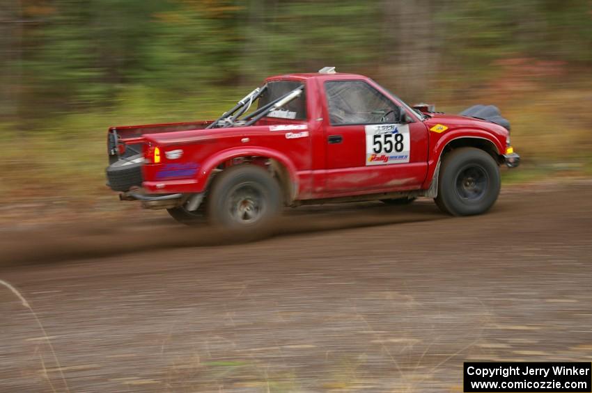 Jim Cox / Ryan LaMothe Chevy S-10 heads uphill near the start of SS1, Herman.