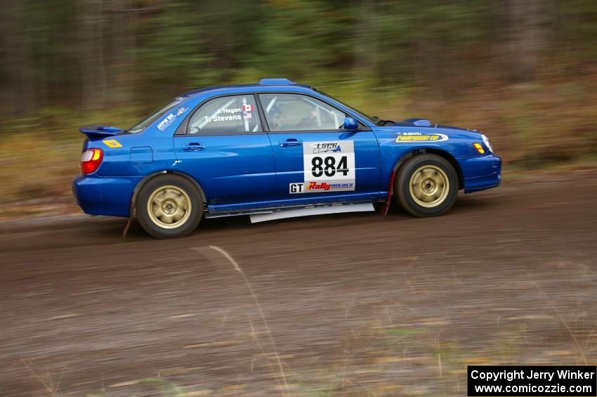 Tim Stevens / Jeff Hagan Subaru WRX heads uphill near the start of SS1, Herman.