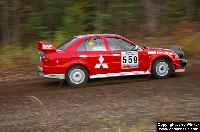 John Rek / Rob Dupree Mitsubishi Lancer Evo 6.5 heads uphill near the start of SS1, Herman.