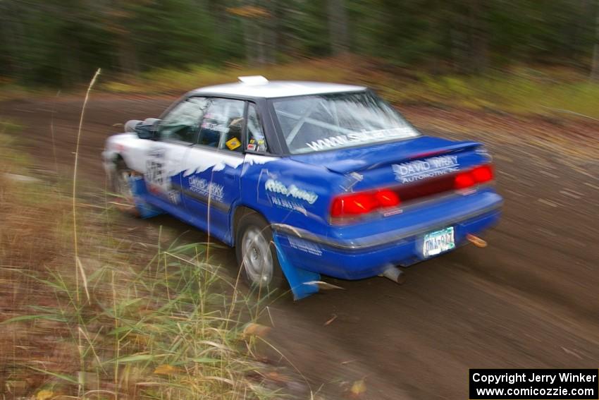 Mike Wray / Don DeRose Subaru Legacy Sport heads uphill near the start of SS1, Herman.