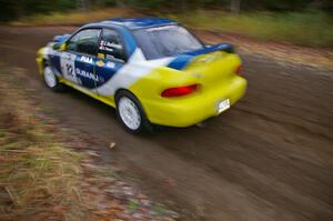 Joan Hoskinson / Jimmy Brandt Subaru Impreza RS heads uphill near the start of SS1, Herman.