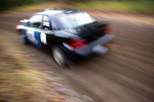 Bryan Holder / Tracy Payeur Plymouth Neon heads uphill near the start of SS1, Herman.