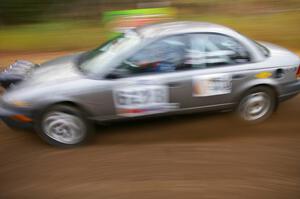 Dan Adamson / Chris Gordon Saturn SL2 heads uphill near the start of SS1, Herman.