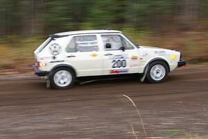 Brett Fairbanks / Chris Greenhouse VW Rabbit heads uphill near the start of SS1, Herman.