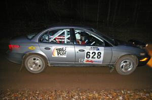 Dan Adamson / Chris Gordon Saturn SL2 crosses the finish of SS2, Menge Creek North.