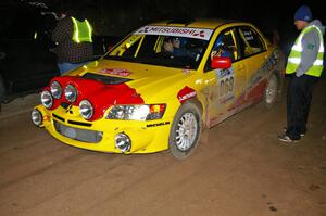 Russ Johnson talks to Gerry Coffey / Dave Dooley Mitsubishi Lancer Evo 8 at the finish control of SS4, Baraga Plains.