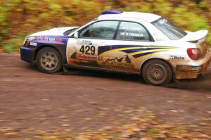 Tanner Foust / Scott Crouch Subaru WRX drifts into the final corner of SS7, Gratiot Lake 1.