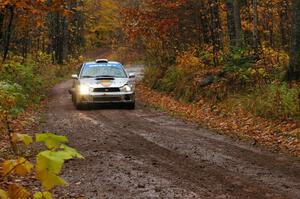 Fintan Seeley / Paddy McCague Subaru WRX STi races uphill in the final section of Gratiot Lake 1, SS7, before the finish.