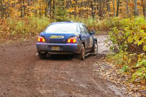 Tim Stevens / Jeff Hagan Subaru WRX drifts the back end through the final muddy corner of Gratiot Lake 1, SS7.