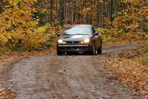 Sans Thompson / Craig Marr Dodge Neon ACR drives downhill after crossing the finish of Gratiot Lake 1, SS7.