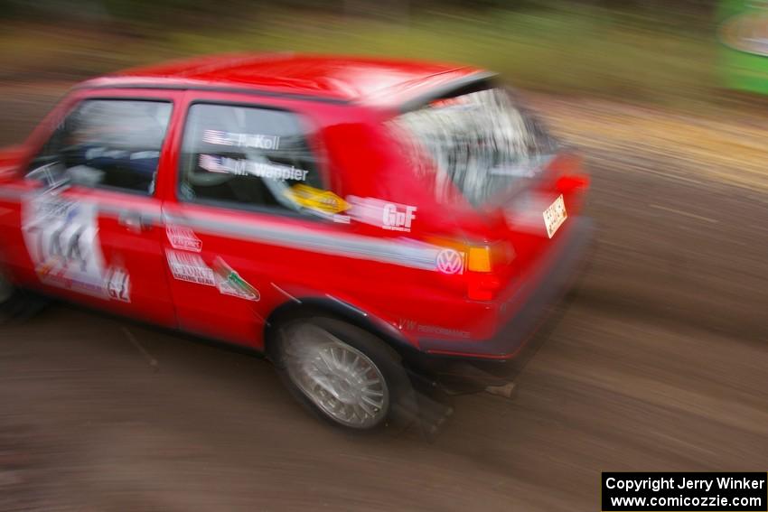 Paul Koll / Matt Wappler VW GTI heads uphill near the start of SS1, Herman.