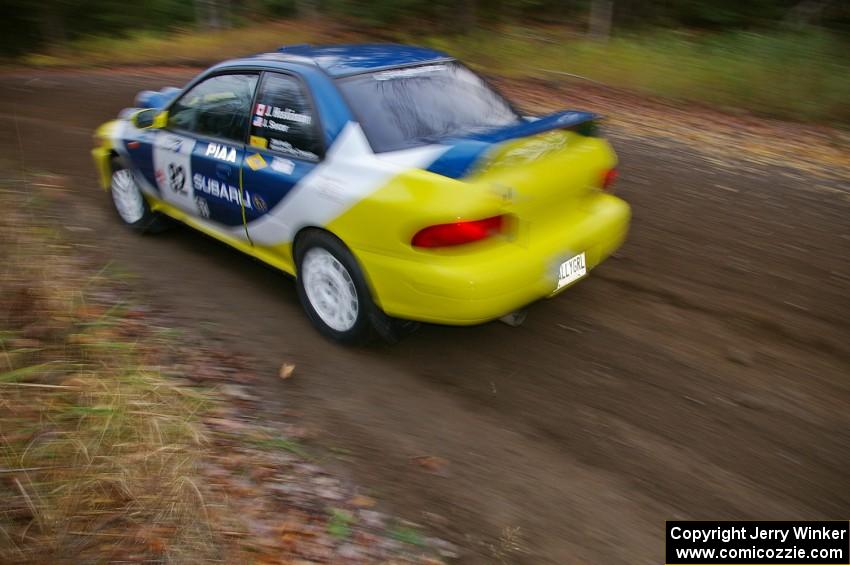 Joan Hoskinson / Jimmy Brandt Subaru Impreza RS heads uphill near the start of SS1, Herman.