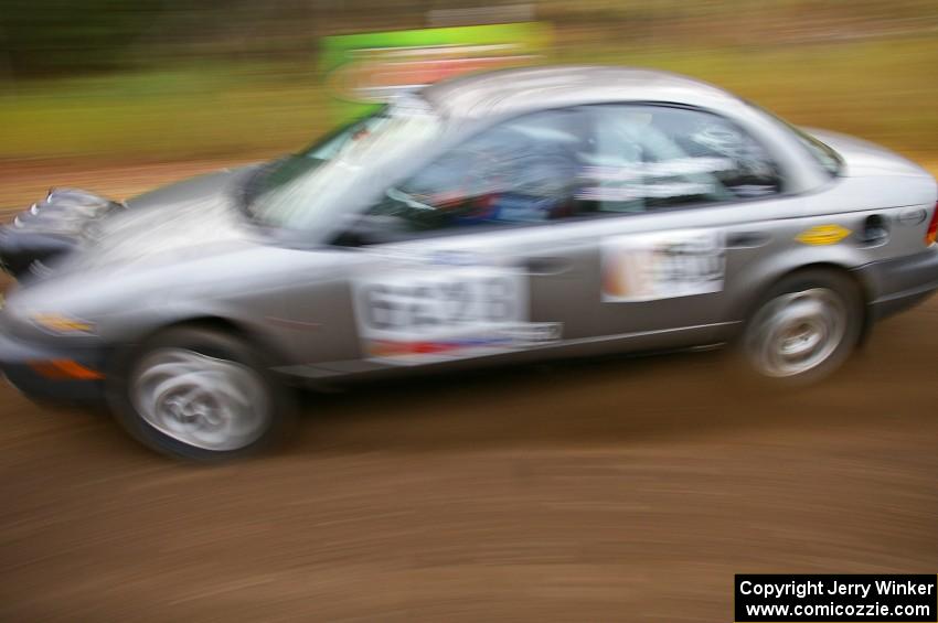 Dan Adamson / Chris Gordon Saturn SL2 heads uphill near the start of SS1, Herman.