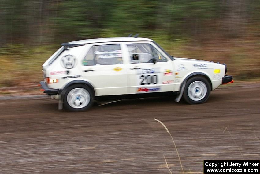 Brett Fairbanks / Chris Greenhouse VW Rabbit heads uphill near the start of SS1, Herman.