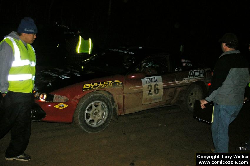 Cary Kendall / Scott Friberg Eagle Talon check into the finish control of SS4, Baraga Plains, and are greeted by Russ Johnson.